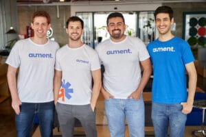 4 founders in branded Tshirt following funding round announcement pre-seed for startup unicorn